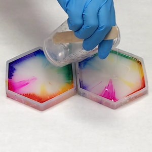 This alcohol ink and resin technique is so simple and fun for a variety of resin projects including coasters, bowls, trays, etc. I love these bright rainbow colors :) | Mixed Media Girl