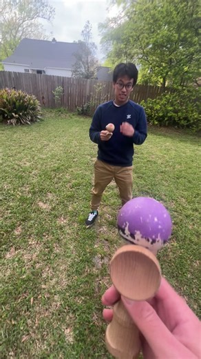 Kendama Skills Demonstration in Backyard Setting
