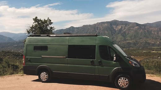 DIY Camper Van Is a Rustic Cabin on Wheels With Lots of Dark Wood and a Copper Shower