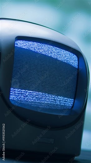 Retro TV, vintage television In a nostalgic setup, a retro TV displays grain on screen, scary halloween night device good for chroma key and green screen.