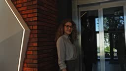 Friendly receptionist welcoming guests and clients in modern office...