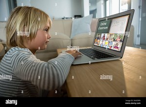 Caucasian boy using laptop for video call, with smiling diverse elementary school pupils on screen. communication technology and online education, dig Stock Photo - Alamy