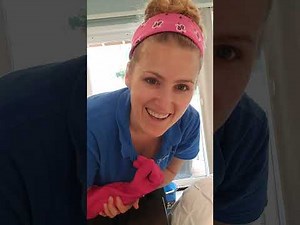 Using water and a squeegee to clean glass slider doors