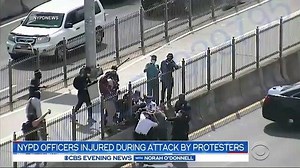6.4K views · 150 reactions | Surveillance video captured New York City Police officers being attacked on the Brooklyn Bridge as protesters for and against the police clashed. The Chief of Department, the top uniformed NYPD officer, was among at least four officers injured. 37 people were arrested. | CBS Evening News | Facebook