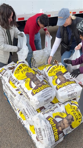 Denver area food bank distributed free food to families struggling to pay their bills in light of the federal government shut down and temporary loss of SNAP benefits. | Trevor Hughes
