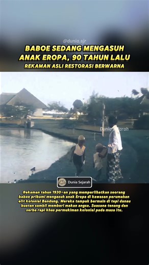 Dunia Sejarah on Instagram: "Momen kehidupan sehari-hari di kawasan perumahan kolonial di Bandung pada era 1930-an. Dalam video tampak seorang baboe (pengasuh pribumi) yang mengawasi dan menemani dua anak Eropa/Belanda saat bermain di tepi sebuah danau buatan di dalam kompleks perumahan elit. Beberapa angsa tampak berkeliaran bebas dan didekati oleh sang anak, sementara sang baboe memastikan mereka tetap aman. Latar belakang menampilkan rumah-rumah besar bergaya kolonial dengan halaman luas dan 