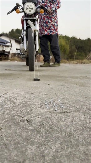 Magnet Experiment: Hang a magnet in front of the tire, nails are attracted and won't puncture it!