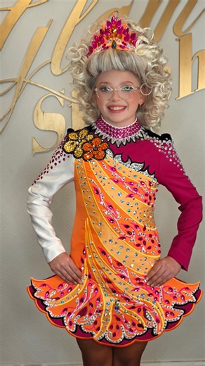 1.2K views · 54 reactions | Grace understood the assignment  This one’s giving bright, bold and totally original orange, fuchsia and maroon with crystals that hit just right ✨ The floral shoulder detailing ties it all together for that perfect Glam Stitch moment   DM to start your design journey ✨ @mcavoyschool ✨ | Glam Stitch | Facebook