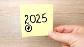 2025 writing in marker on a note sheet. 2025, numbers concept.
