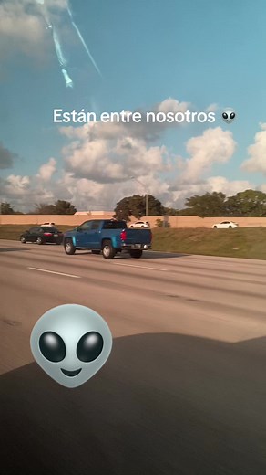 Blue Pickup Truck Drives Through Scenic Highway