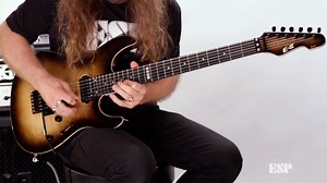 UK-based guitar hero Jamie Hunt is here for this outstanding demo of the ESP E-II SN-II Nebula Black Burst. Formerly called “ESP Standard”, all ESP E-II instruments are created at our ESP factory in Tokyo, Japan, and are designed for professional players who accept no compromises in tone, feel, or reliability for their guitars and basses. The E-II SN-II features bolt-on construction at 25.5” scale, with an alder body and burled maple top in a fantastic Nebula Black Burst finish and natural maske