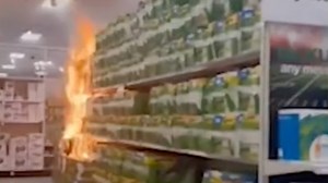 Shocking photos show fire rip through shelves in Target causing $1m in damage