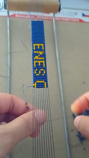 Intricate Beading Process: Crafting a Bracelet Close-Up