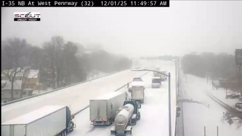 Truck drivers walk on closed Interstate 35 near downtown KCMO