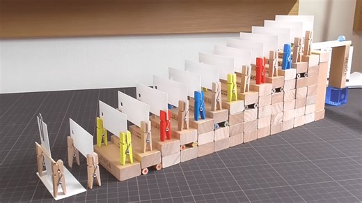 How to make a marble and domino "stair return" Rube Goldberg device