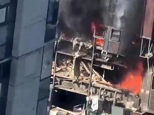 Gas explosion blows hole in luxury high-rise