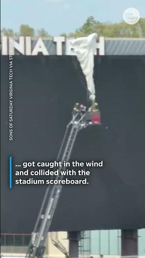 Skydiver crashes into stadium scoreboard
