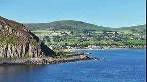 Ballygally on The Antrim Coast Road in Northern Ireland. Part of the Causeway Coastal Route. Aerial 50fps UHD