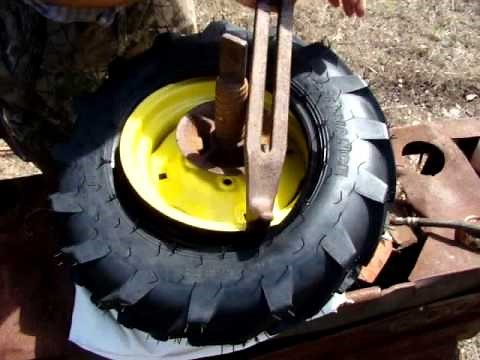 Mounting directional tread tires on a garden tractor.