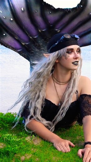 Mermaid at the beach gets hit in the face by her tail