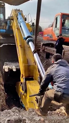 Digging Out Trouble: How Teamwork Fixes a Stuck Excavator