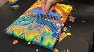 Acrylic pour painting with an intricate pattern made with a comb. | Pour Away Fluid Arts