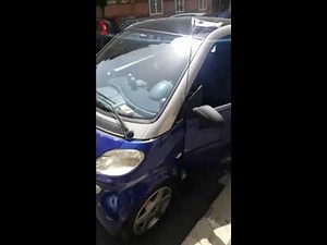 What is the way to reprogram the key of the Smart Fortwo?