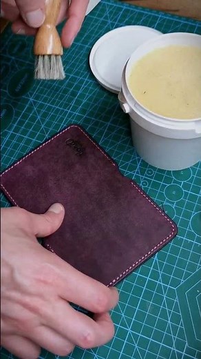 Applying bees wax on a leather good before sending it to the client. Leathercraft