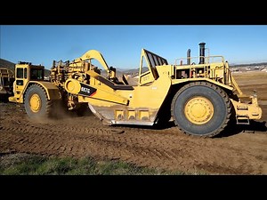 CAT 657B and 657G scrapers in action