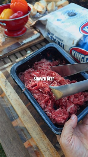 Shaved beef is budget friendly, but with Kingsford charcoal and a few simple tricks, they become a weeknight winner. Recipe: Mix beef with salt, pepper, and worcestershire sauce Grill beef on a skillet over direct heat until its cooked through Do the same with peppers and onions Add beef, veggies, and provolone cheese onto your bread Return to the grill on the indirect side, add the lid, and grill until cheese is melted | Kingsford
