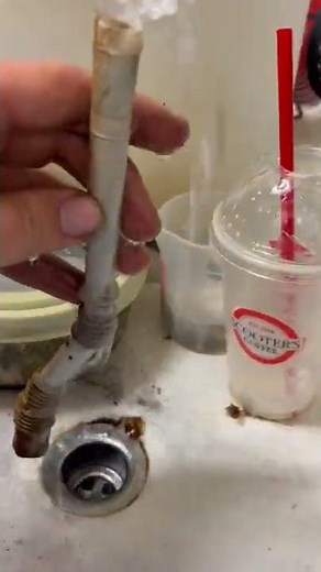 Unclogging a defrost drain line on a freezer. #HandsomeOrHandy #Handyman #HomeMaintenance