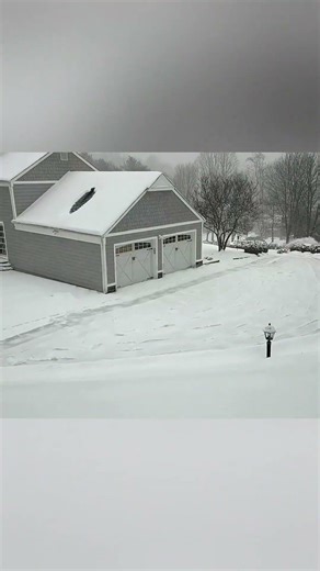 SnowBot AI Snow Blower braving the winter storm!