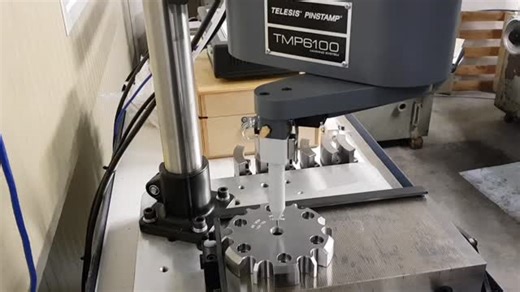 The Telesis TMP6100 is the most versatile pinstamp marking system. This full-programmable system can easily be integrated into either on or off-line marking applications. Since the marking pin can be positioned anywhere in a 152mm x 304mm marking window, the TMP6100 can mark any character height, style or number of lines desired. Its robotic design allows clear access to the marking window for loading and unloading of parts. #permanentmarking #identification #traceability #trackandtrace #dotpeen