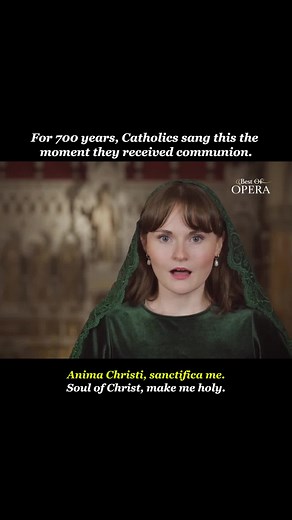 🎶 Anima Christi (Marco Frisina) — Sophie Clarke 🕊️ Nobody signed this prayer. It appeared in a manuscript dated 1334, with no author attached. For 700 years, Catholics have prayed it the moment the host touches the tongue. Twelve lines. No preamble. Just a voice asking Christ to sanctify it, hide it within His wounds, and call it at the hour of death. ⛪ Marco Frisina set the prayer to music in 2000. He is a Roman Catholic priest who composes. In the late 1970s, John Paul II heard him play whil
