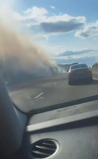Fiery scenes on the M4 in Wiltshire right now — where it appears a wildfire has broken out. 🔥 Slow traffic between junctions 14 and 15 westbound as emergency services attend. The carriageway may be closed shortly. | Wiltshire 999s
