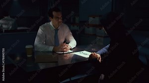 Police detective in interview room interrogating a suspect