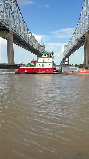 Tugboat pushes a barge under bridges on Mississippi River at Port of New Orleans #tugboat #barge