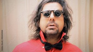 An extrovert man receives a whipped cream pie in the face while dancing. Funny classical slapstick comedy gag.