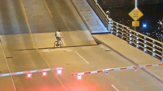 Close call: Cyclist nearly falls into drawbridge gap