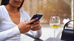 Close-Up beautiful young female hands using phone during lunch break city life. Business woman work in cafe. Student checking text, online messaging, hispanic woman online shopping