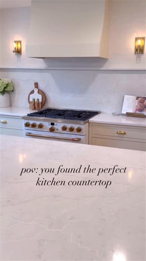MSI Surfaces on Instagram: "We’re so happy that @tinabeliveau found her dream kitchen surface with MSI! Calacatta Miraggio Cove® quartz is the perfect mix of warmth and refinement—with gold, white, and beige veining on a soft Carrara-like base. Thanks to our exclusive LumaLuxe® Ultra tech, it captures light like no other."
