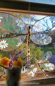 Here's the full tutorial for the "stained glass" dragonflies I shared earlier 💛 I'll have the supplies down below! These turned out so beautifully and the evening sun shining through them was even more beautiful than I thought it would be! I hope you enjoy the video 🥰 #windowcling #stainedglass #diydecor #diyhomedecor #fauxstainedglass #dragonflies #summervibes #summerdecor #howto #tutorial #craftersoffacebook #craftingideas | Love Crafted Decor