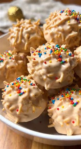 White Chocolate Haystacks Ingredients: 18 ounces white almond bark 5 ounces chow mein noodles, or 3 cups (I used La Choy) ¾ cup roasted and salted peanuts 4 tablespoons colorful nonpareils Instructions: Add the white almond bark to a large heat-safe mixing bowl. Heat in the microwave in 30-second intervals, stirring after each interval, until completely melted and smooth. Line a baking sheet with waxed paper and set it aside. Stir in the chow mein noodles and peanuts. Continue stirring until the