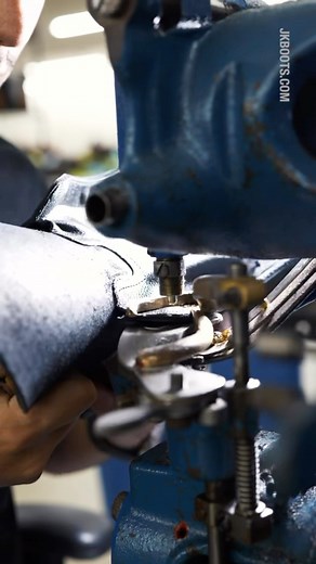If you’ve ever looked at a pair of boots and wondered how they get those eyelets in there, this is the video for you! It may look easy to punch eyelets into boots, but it takes time and practice to master the this part of the build. With some trusty old tools, steady hands, and a good eye, our craftsmen get it right every time. #oldtools #steadyhands #goodeye | JK Boots
