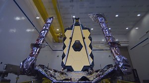 The Webb Space Telescope is marking one year of cosmic photographs with one of its best yet: the dramatic close-up of dozens of stars at the moment of birth. NASA unveiled the latest snapshot Wednesday, revealing 50 baby stars in a cloud complex 390 light-years away. | CGTN