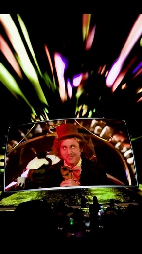 Cosm on Instagram: "Come with me and you’ll be in a world of Shared Reality 🎩 You told us. We listened. Another cinematic experience is coming to Cosm. 🎥 Beginning on November 21, 2025, Cosm will immerse fans in the world of the original 1971 timeless classic Willy Wonka & the Chocolate Factory. 🌈 Developed in collaboration with Warner Bros. Pictures, Little Cinema, and MakeMake, this family-friendly cinematic production will transport long-time fans and families into the