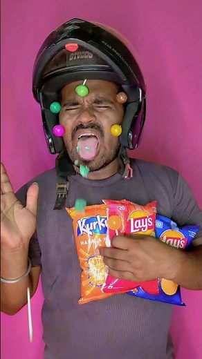 pink yellow and blue lollipop or big paket chips kurkure by technical fuchkul