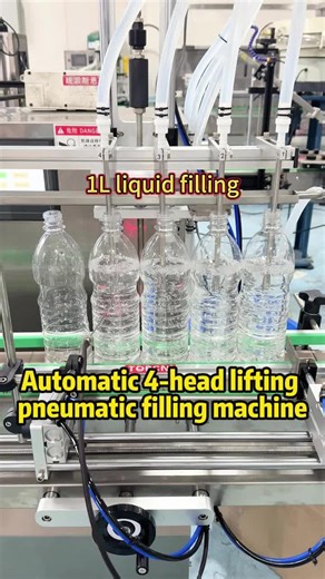 Fully automatic four nozzles pneumatic lifting filling machine, 1L liquid filling, the back end can be connected to the capping machine and the labeling machine #filling #liquidfillingmachine #fillingmachine #liftingfilling #factory #topcn #machinefactory #fillingmachinefactory