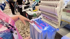 From Applique Getaway 2024: #HappyJapan machine owner and online sensation Nicky Adamkiewicz of The Sassy Subber Designs demonstrates this easy technique combining sublimation, rip-away vinyl and embroidery for a gorgeous multi-media effect. Digitizing credit for the MAMA design goes to Embroidery by Teresa. | Texmac Happy Embroidery Machines