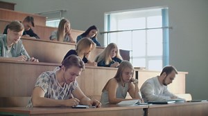 Hands of the Lecturer while he Gives Lecture to a Classroom Full Of Students. Young People Listening to a Lecture in the University. | Premium Stock Video Footage